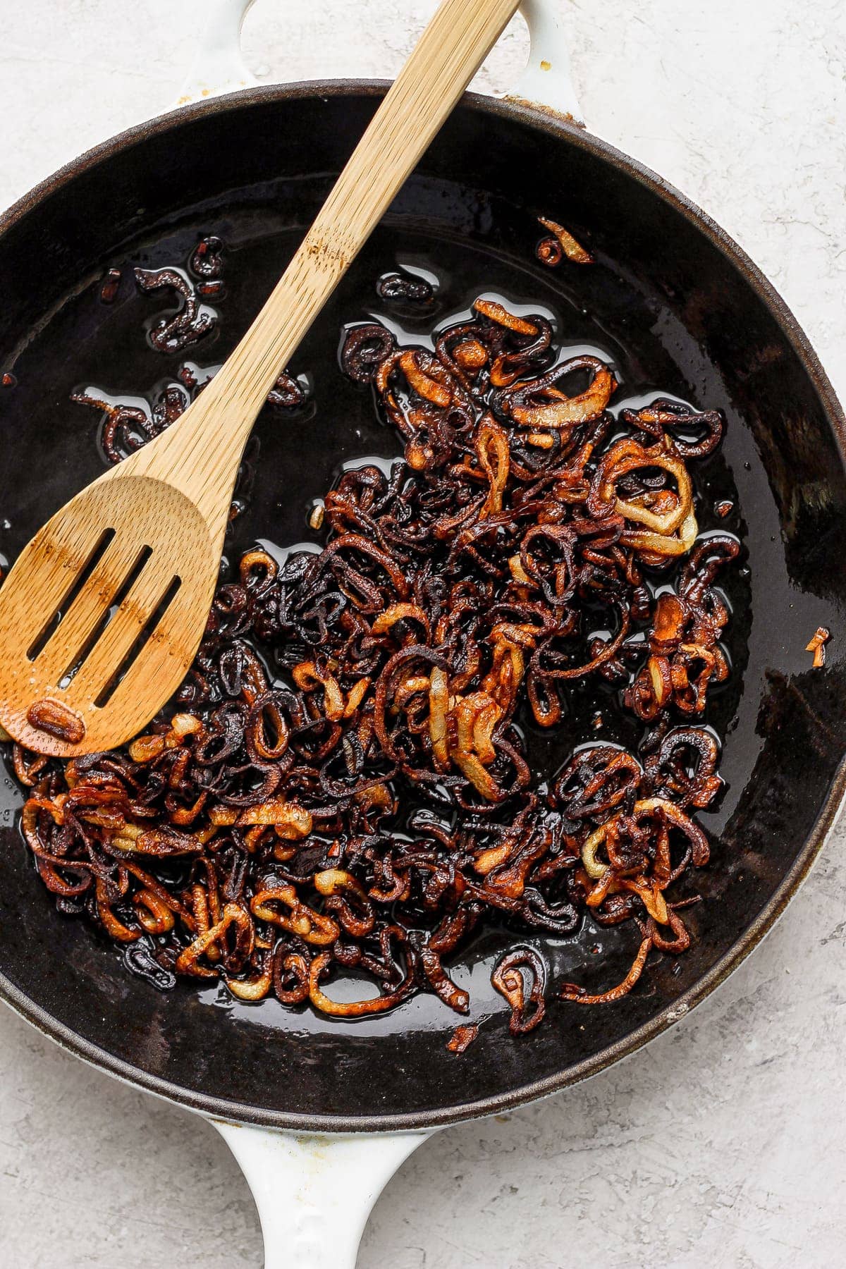 Shallots frying in pan. 