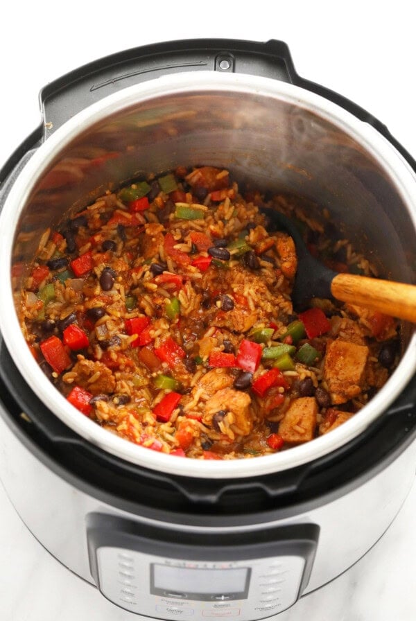 instant pot burrito bowl in the instant pot, ready to be stirred together and then served