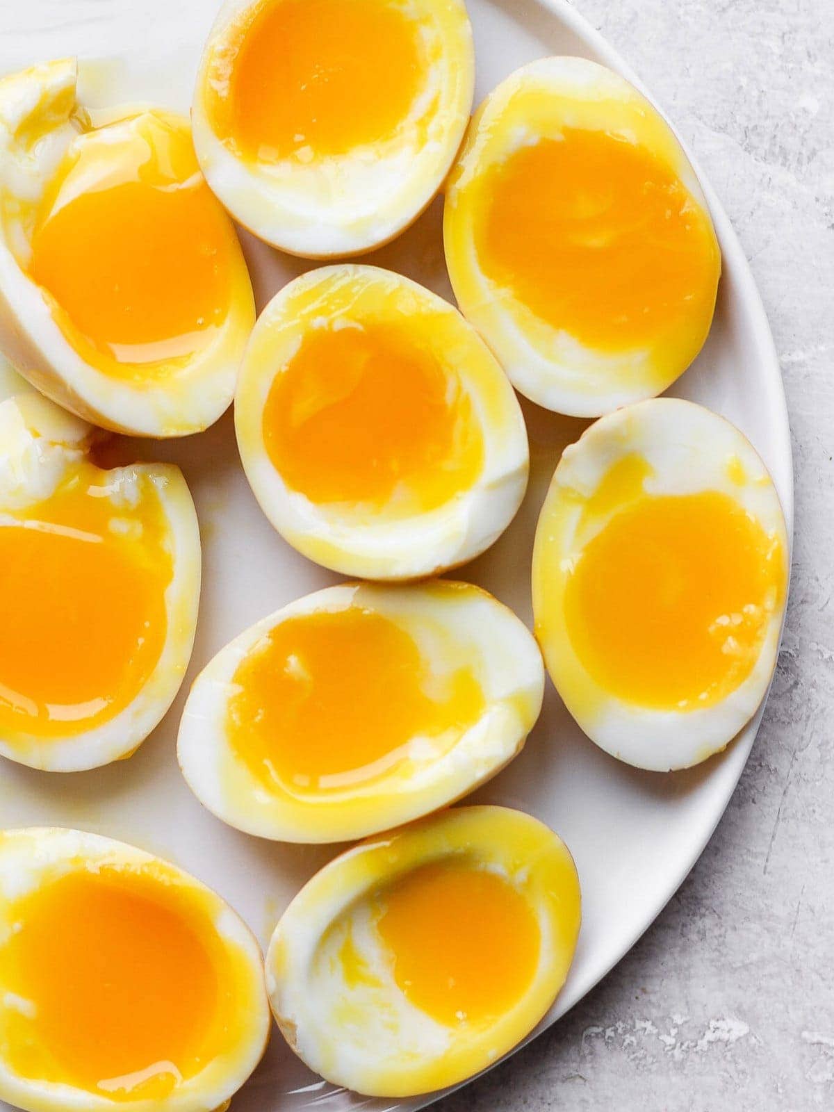 Soft boiled eggs on a plate.