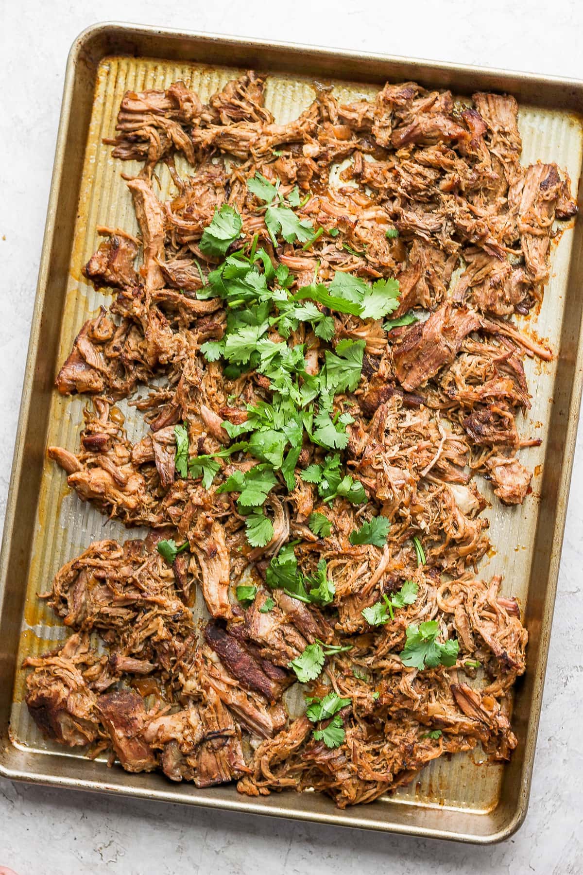 Carnitas on a baking sheet. 