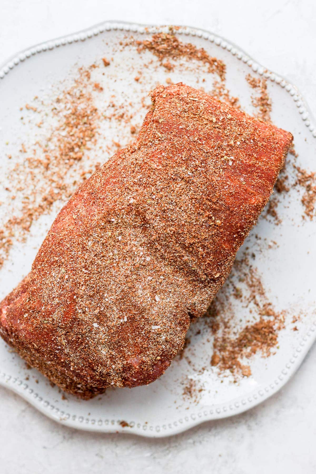 A pork roast dry rubbed in spices. 