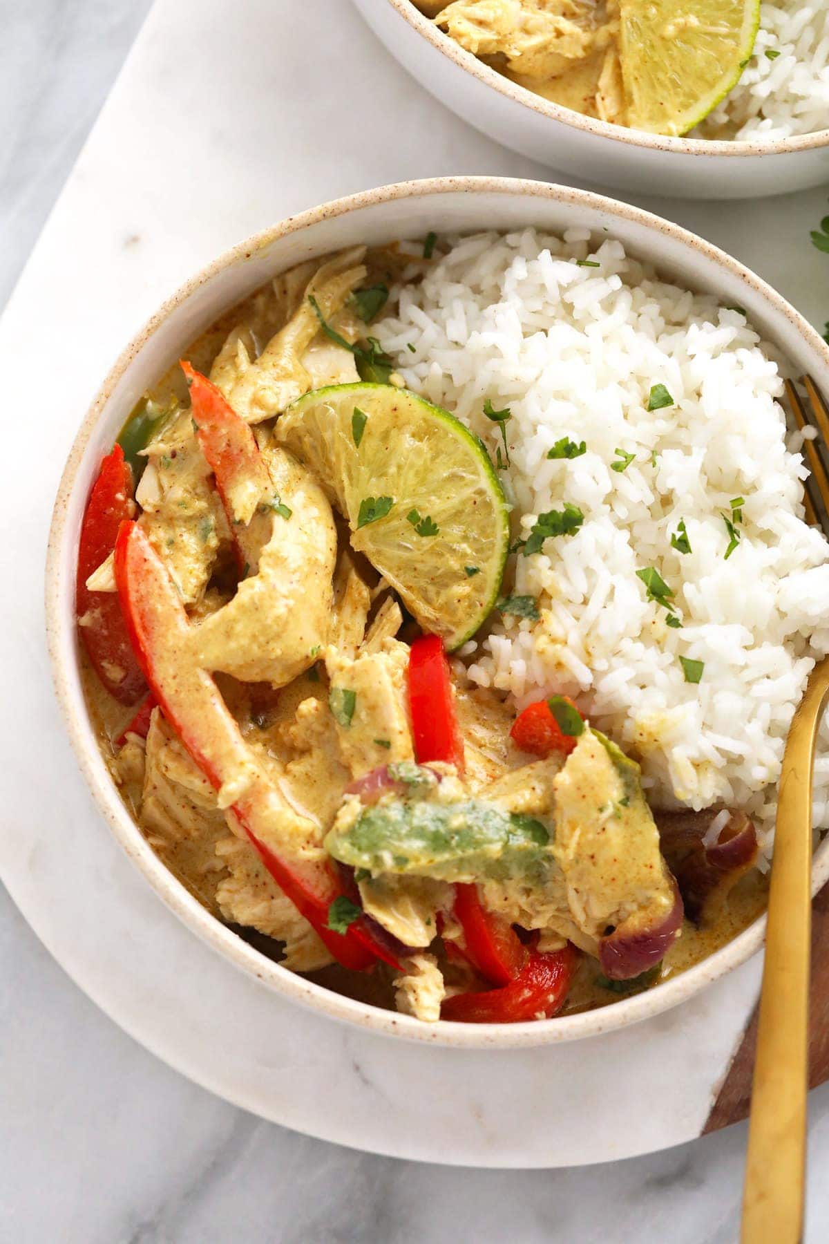 A bowl of coconut curry chicken and rice. 