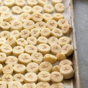 sliced bananas on a baking sheet.