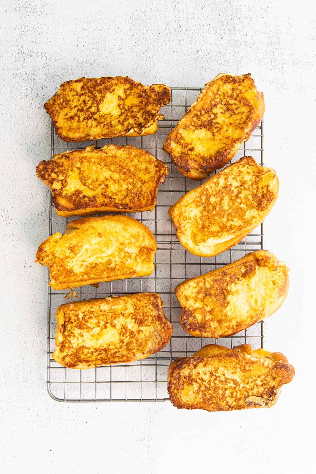 cooked french toast on a cooling rack and ready to be served