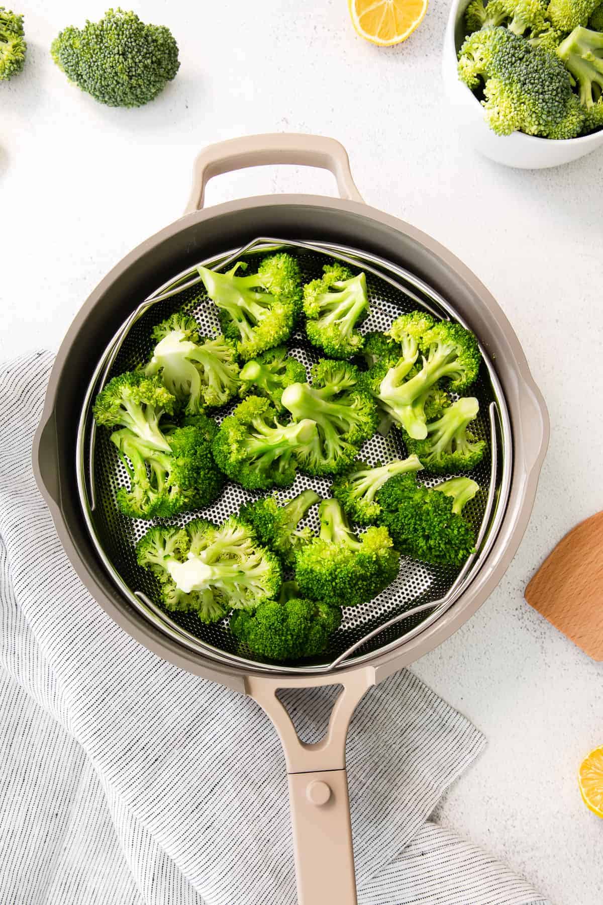 steamed broccoli in steamer basket