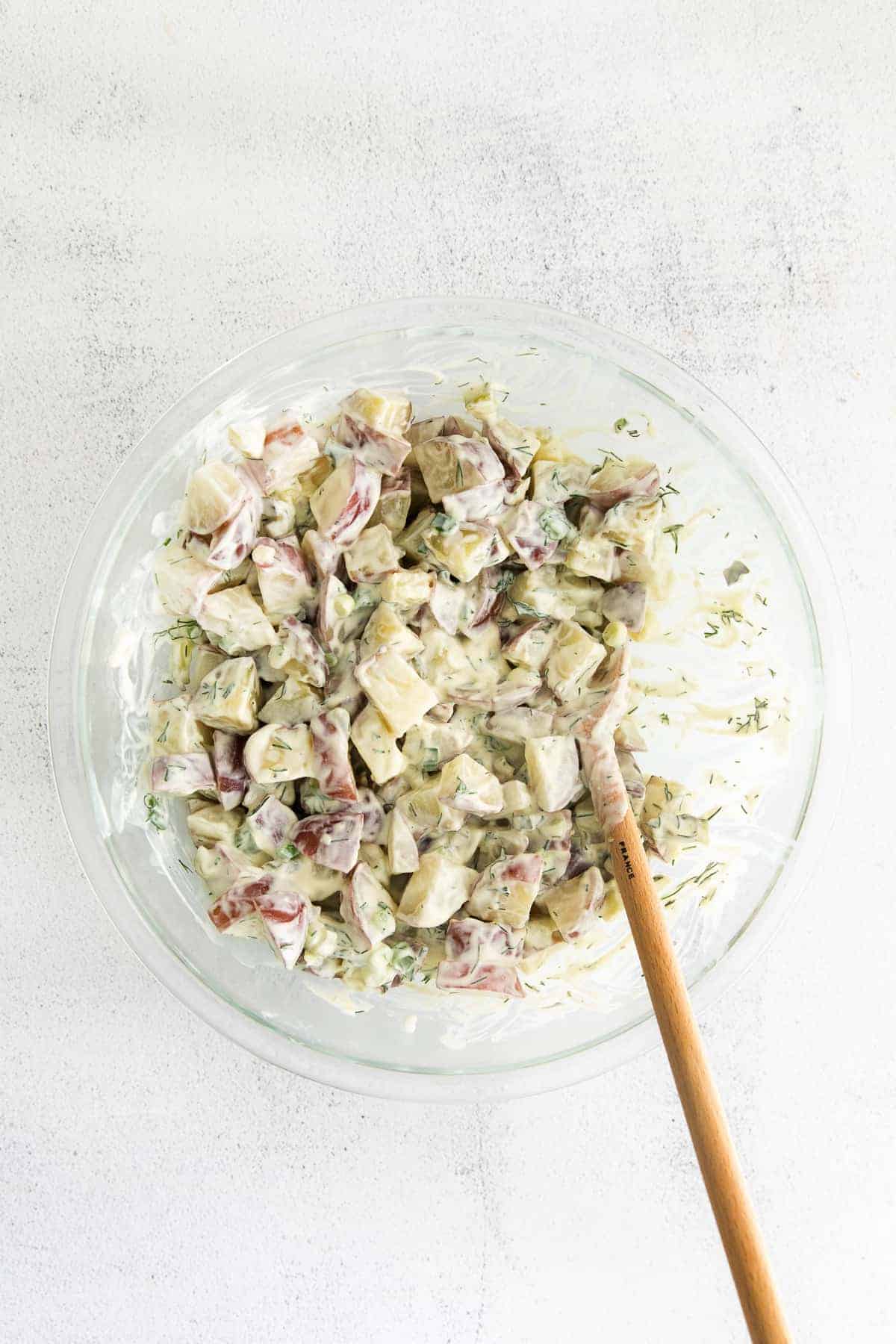 Red potato salad in a bowl. 