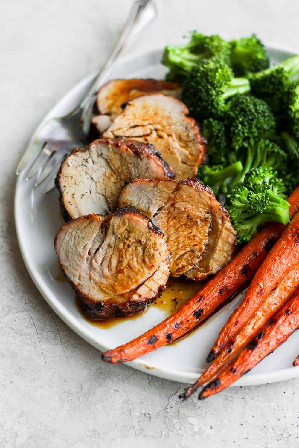 juicy sliced pork on a plate.