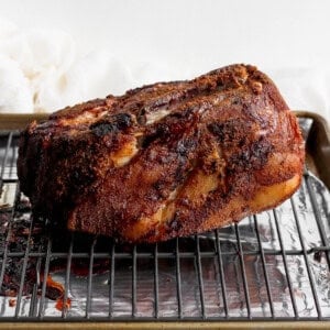 a bbq pork roast on a baking sheet.