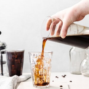 Pouring cold brew coffee into a glass