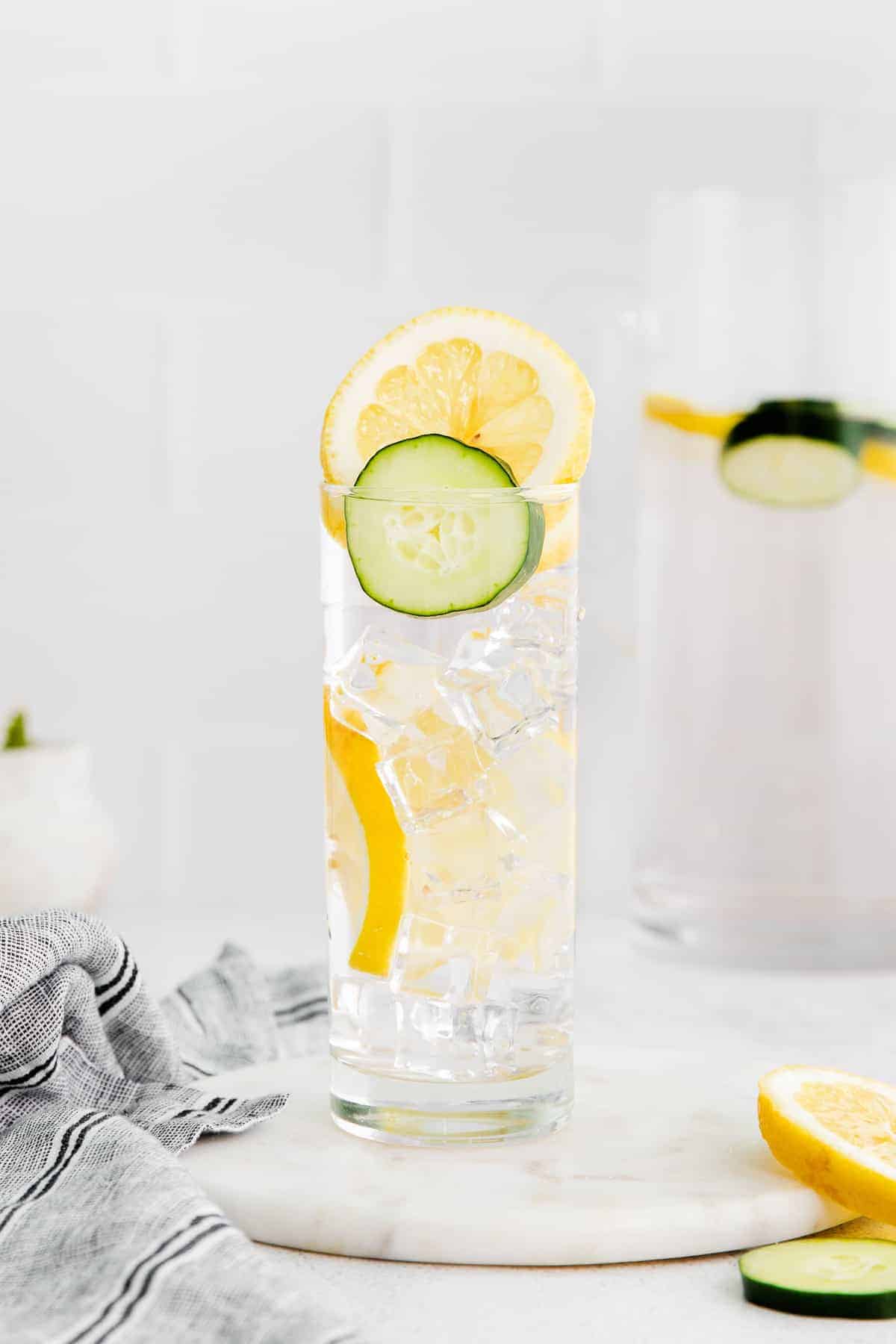 Cucumber and lemon infused water in a glass.