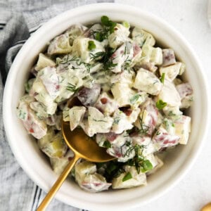 A bowl of red potato salad.