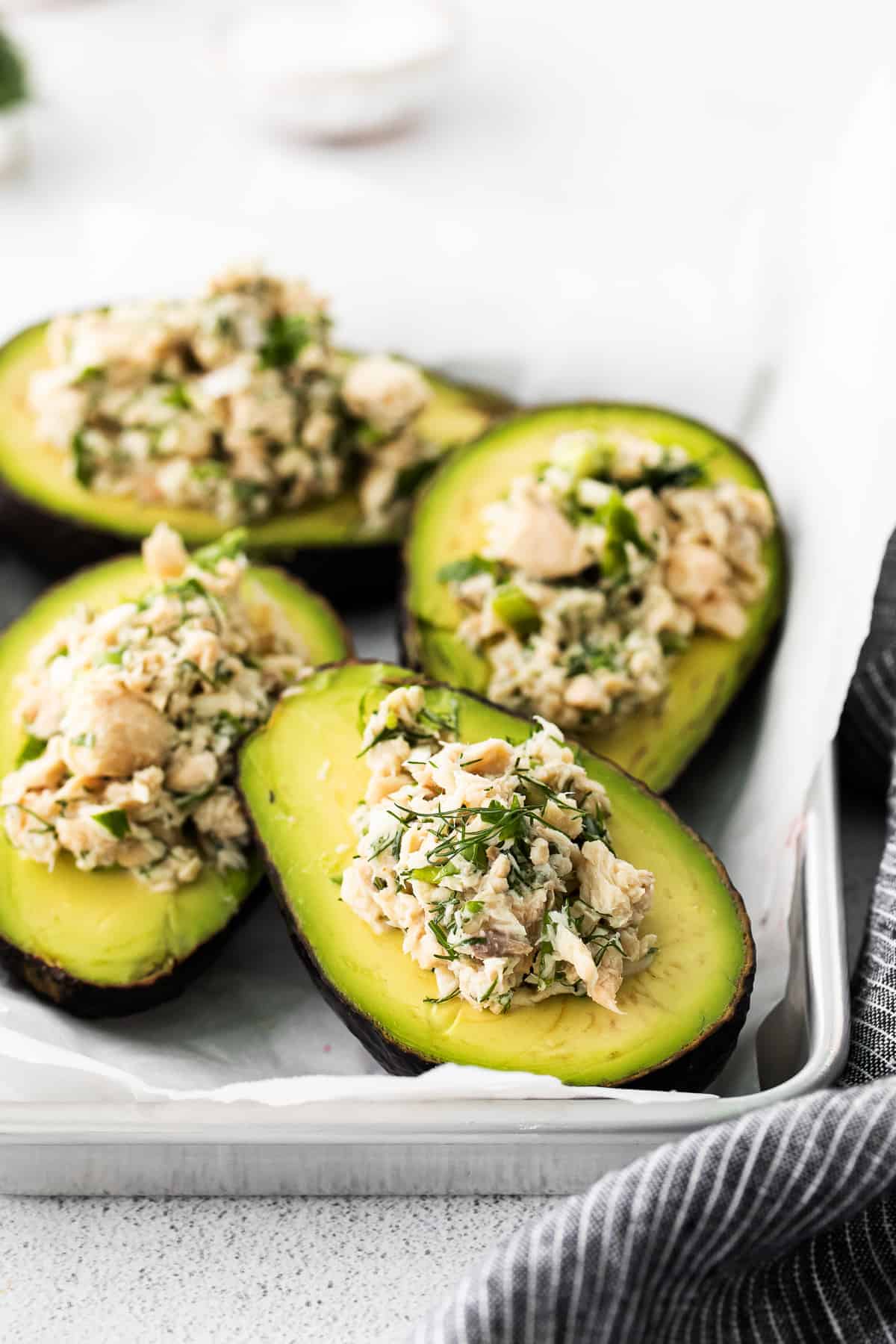 Stuffed avocado boats on a plate. 