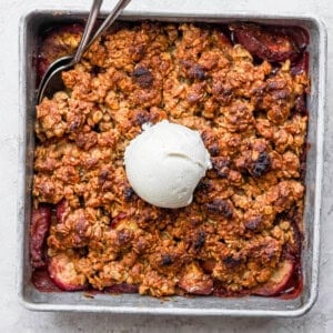 peach crisp in a square baking dish.