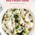 Red potato salad in a bowl.