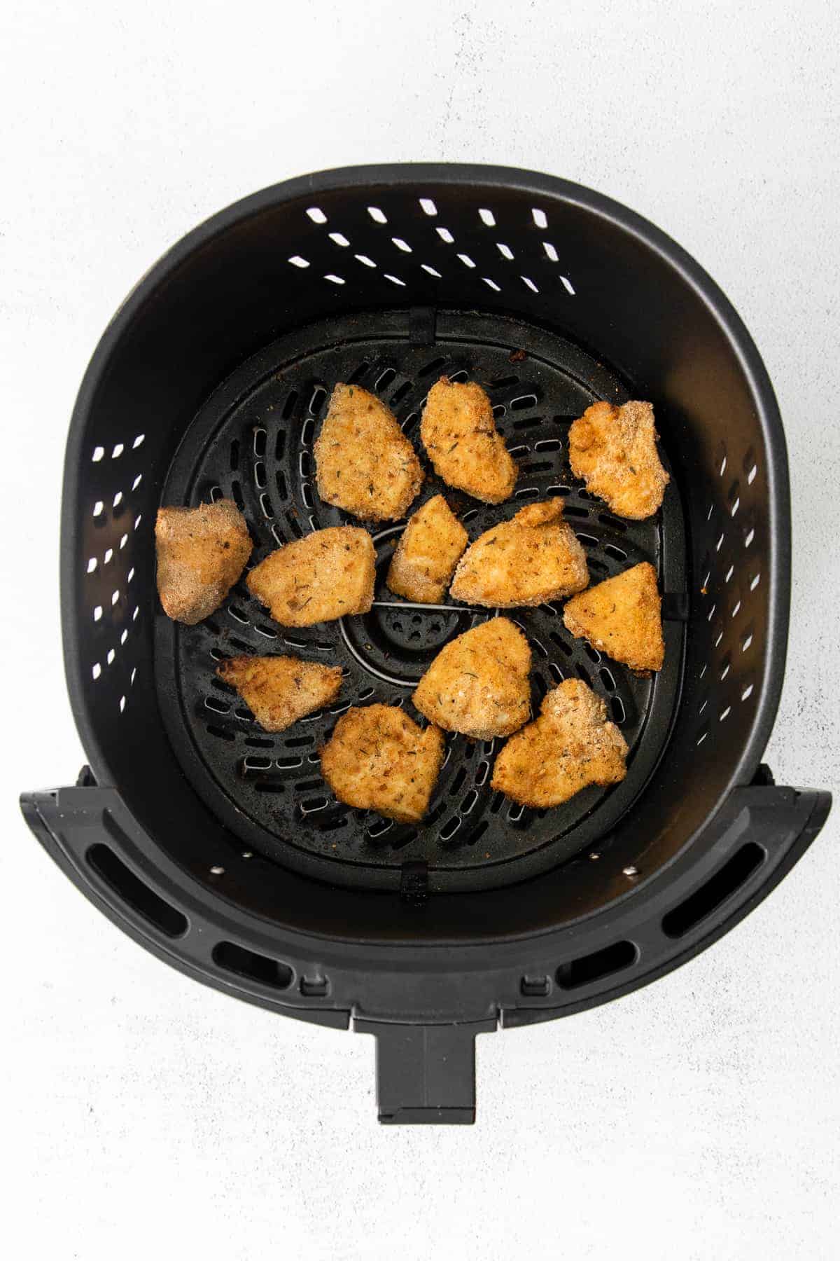 Air fryer chicken nuggets after they've been cooked. 