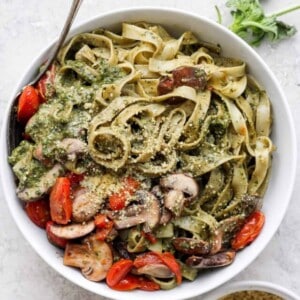 a bowl of vegan pesto pasta