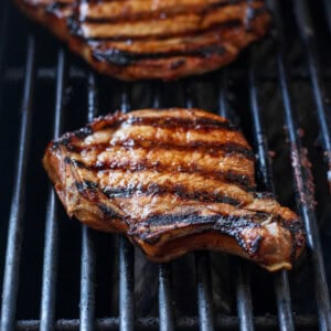 grilling pork chop on grill.