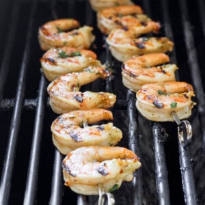 shrimp on skewers on grill.