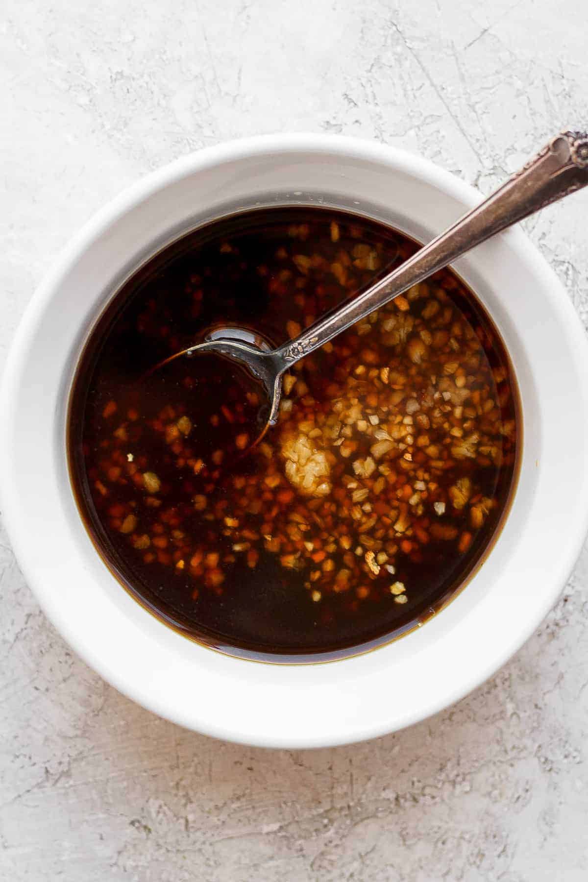 marinade in bowl with spoon.