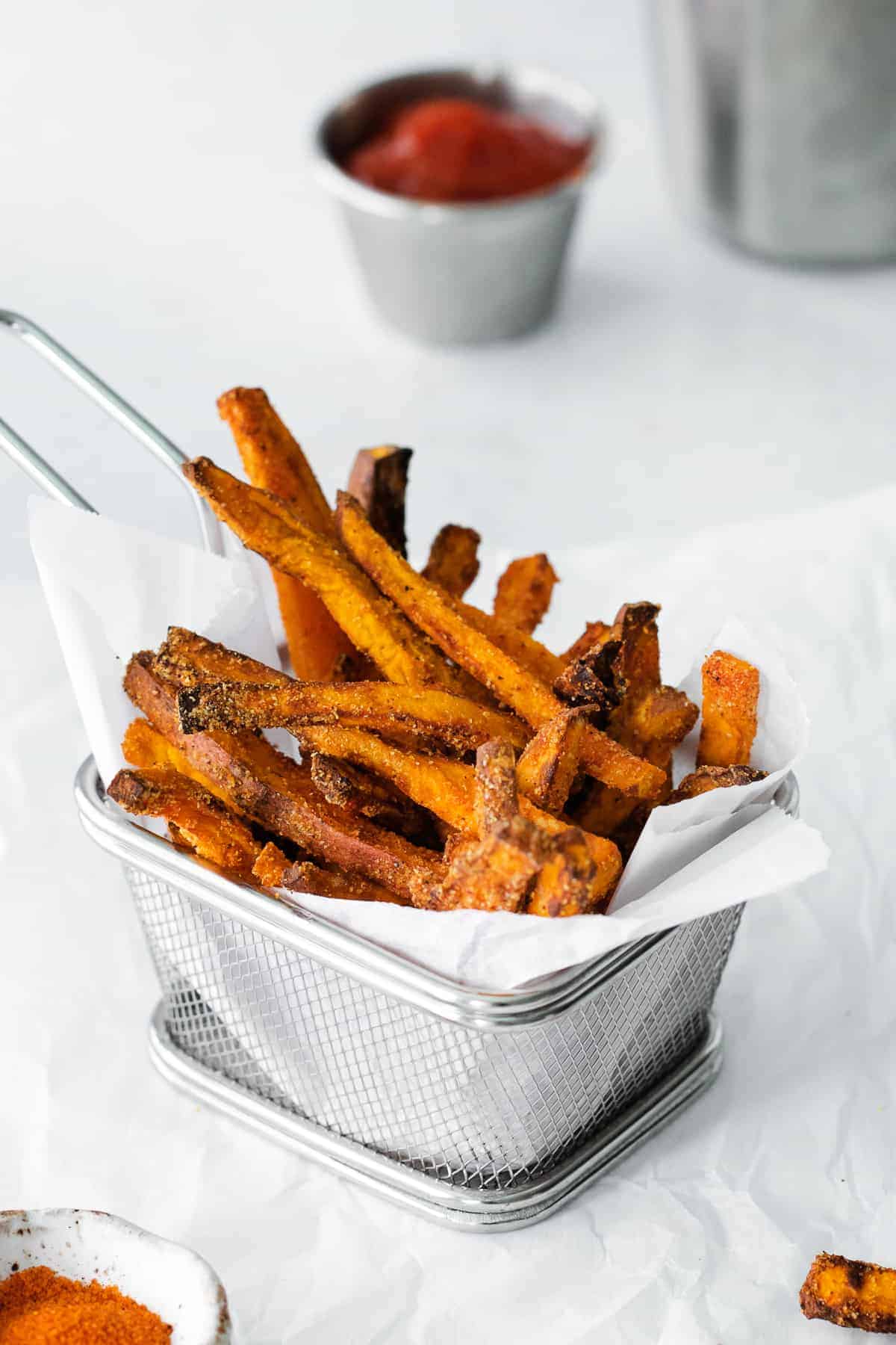 air fryer sweet potato fries in a fry basket