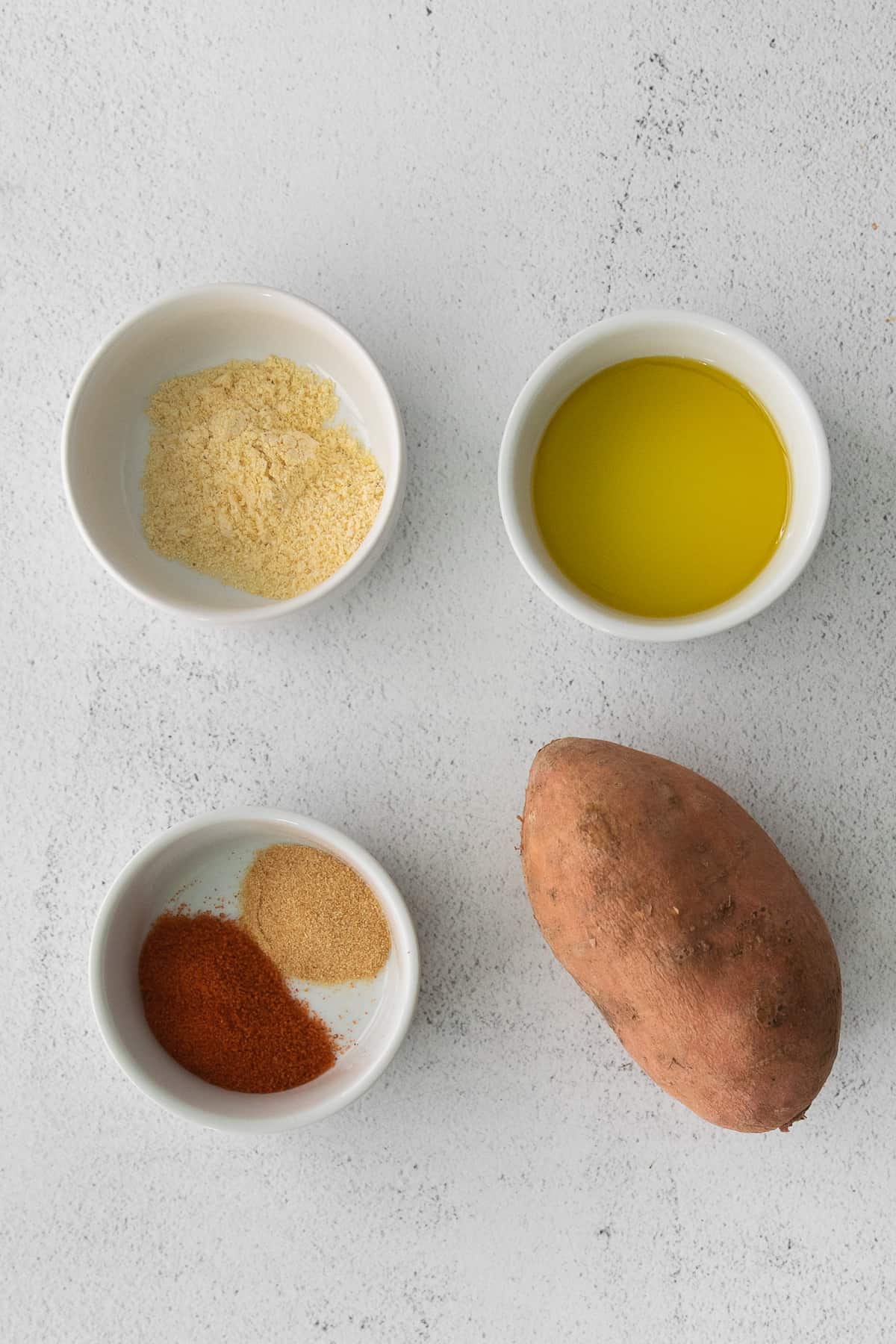 ingredients for air fryer sweet potato fries in bowls