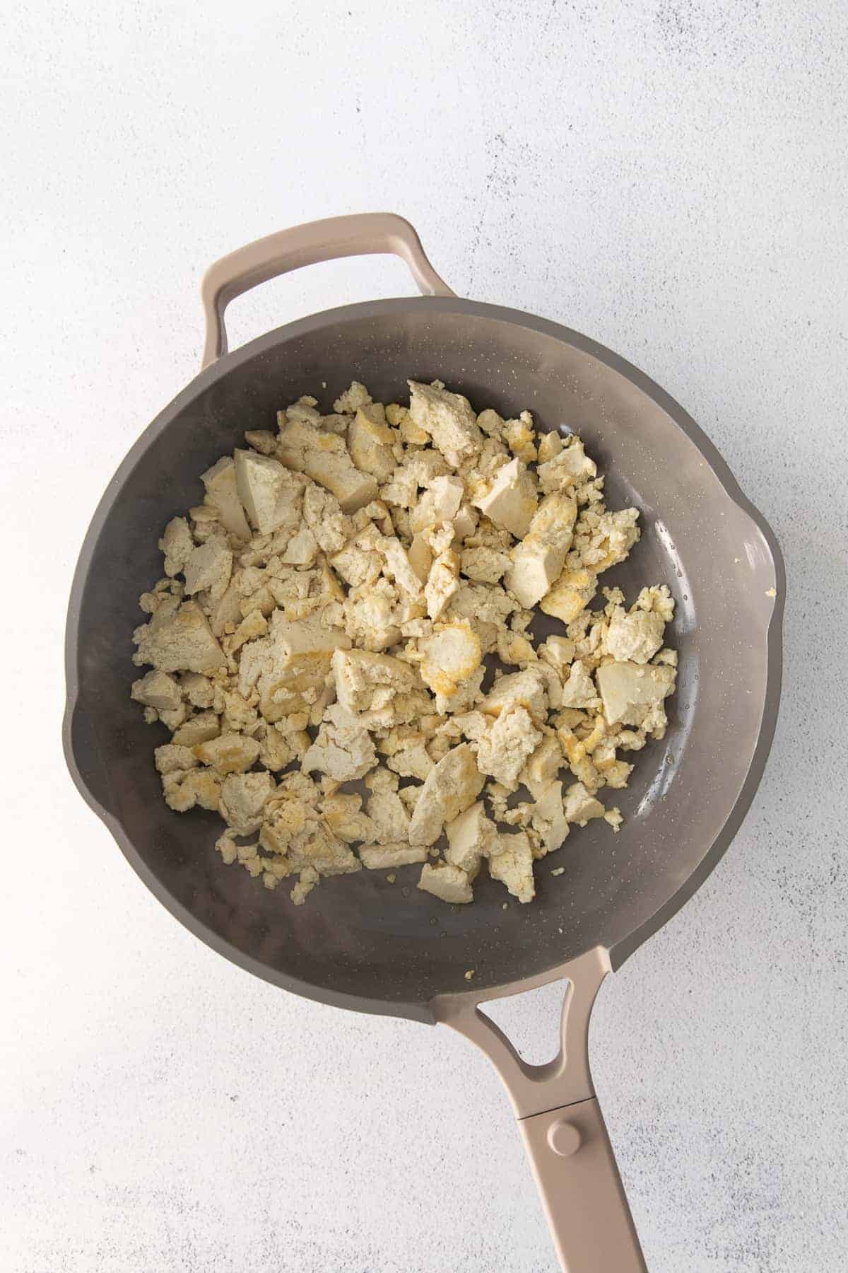 Crumbled tofu in a pan. 