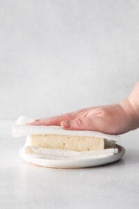 Pressing the moisture out of air fryer tofu.