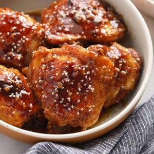 Honey garlic sesame chicken in a bowl.