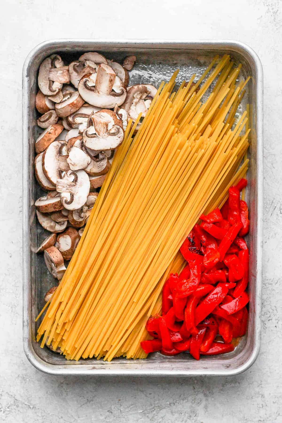 All the ingredients for one pot pasta in a casserole dish. 