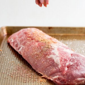 seasoning ribs with spices.