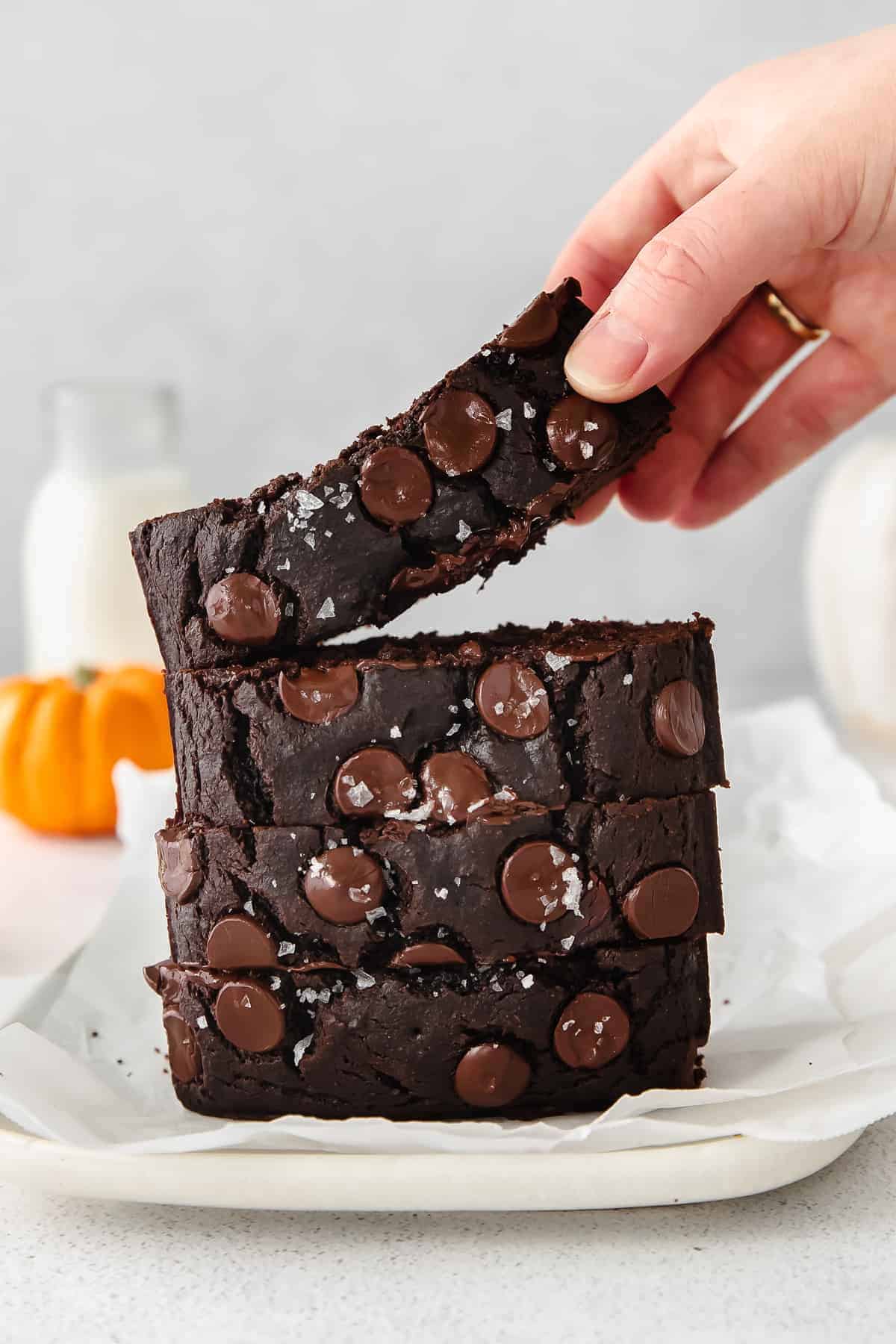 A stack of chocolate pumpkin bread. 