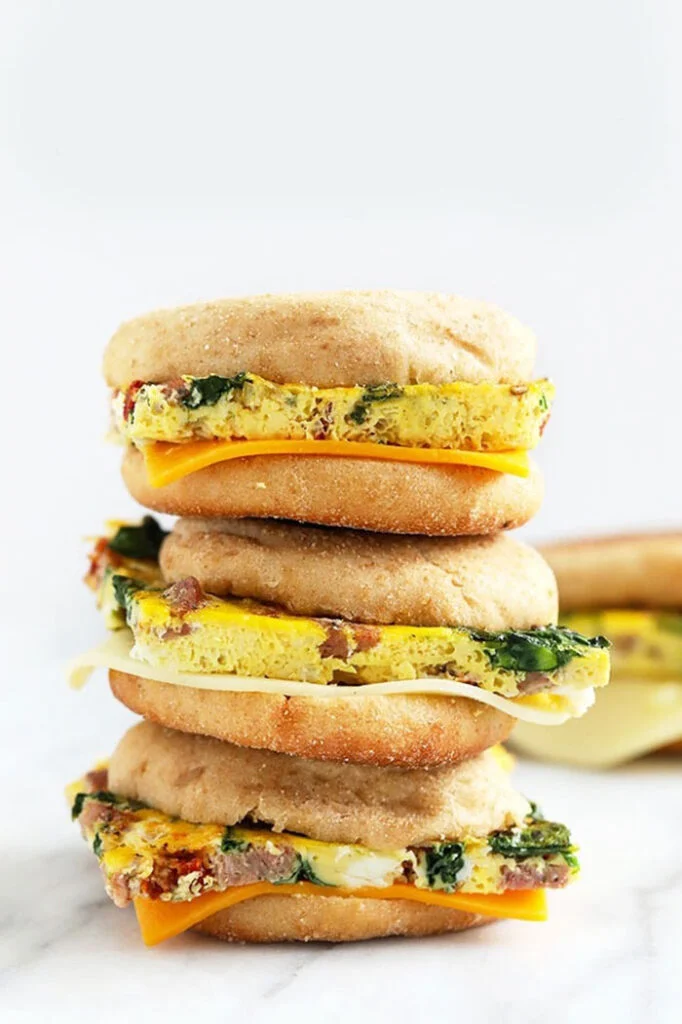 freezer breakfast sandwiches stacked three high.