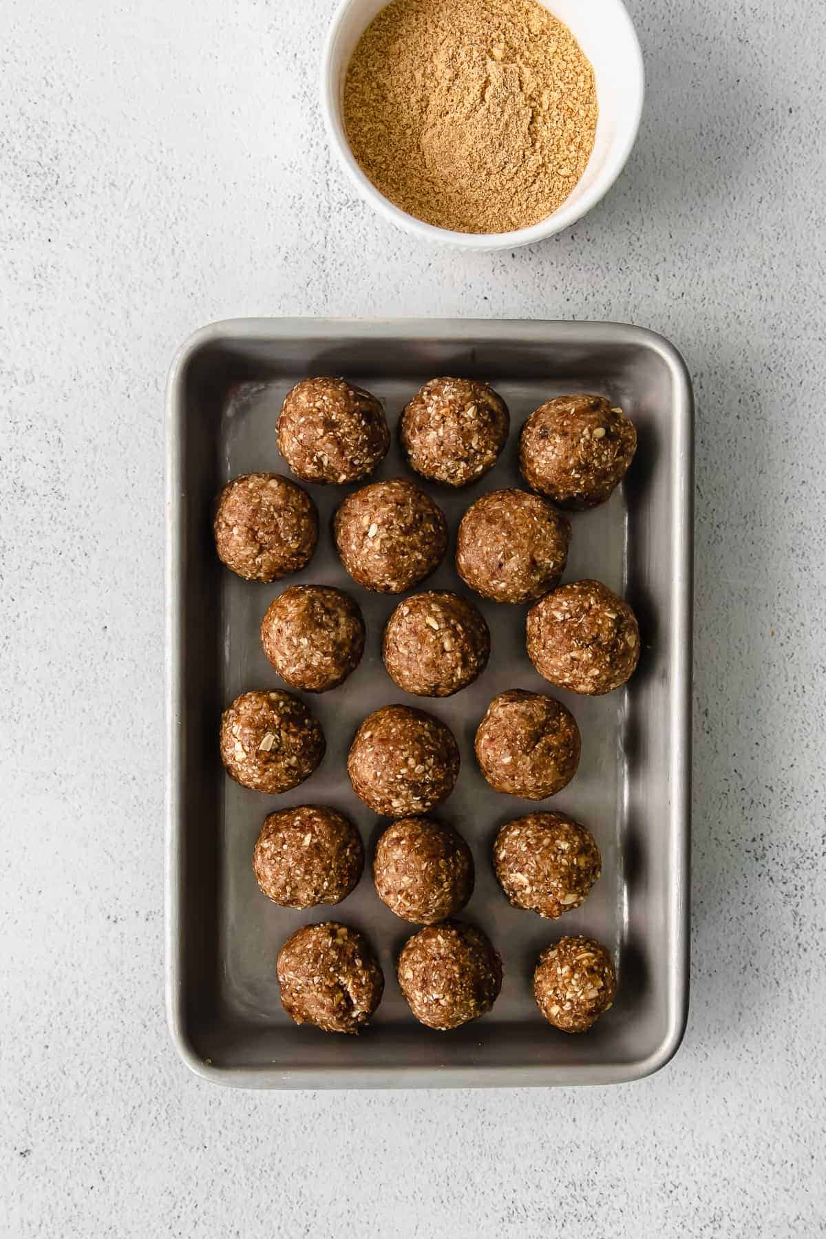 Pecan pie energy balls on a baking sheet. 