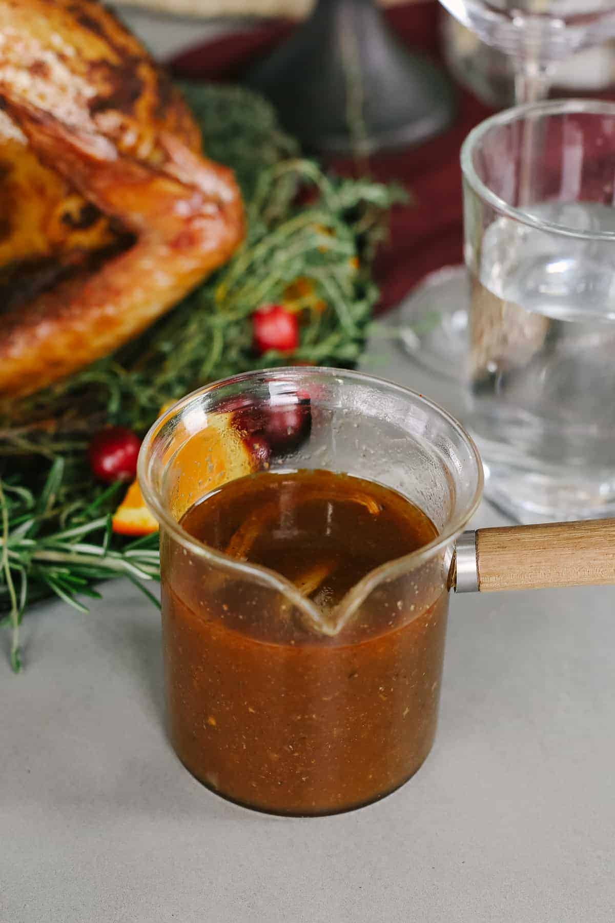 Smoked turkey gravy in a glass jar. 