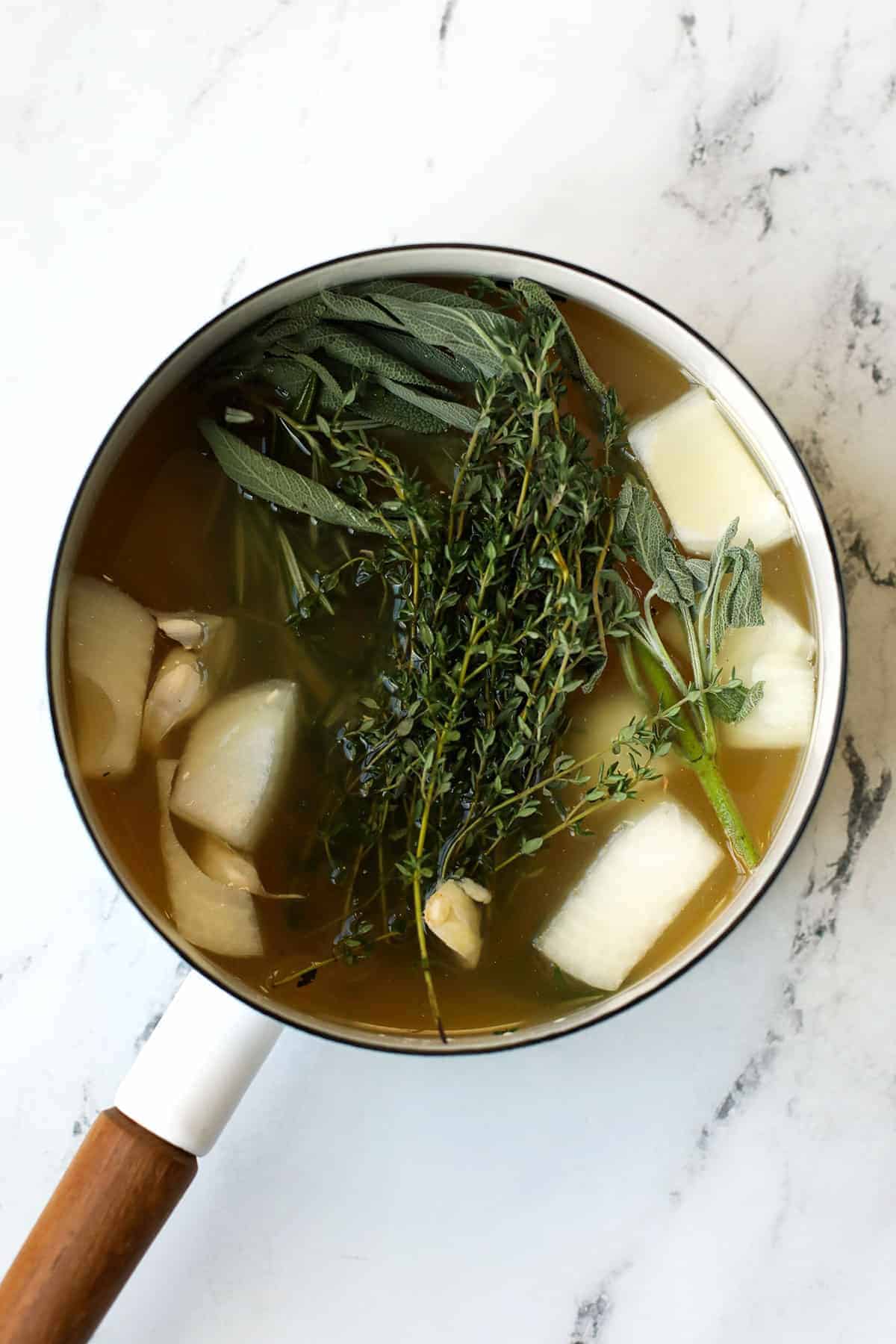 A saucepan with smoked turkey brine. 