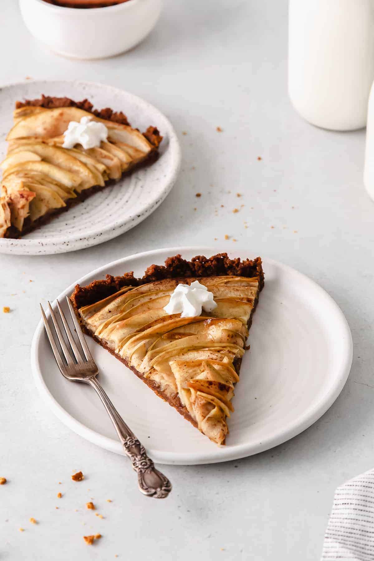 A piece of apple tart on a plate. 