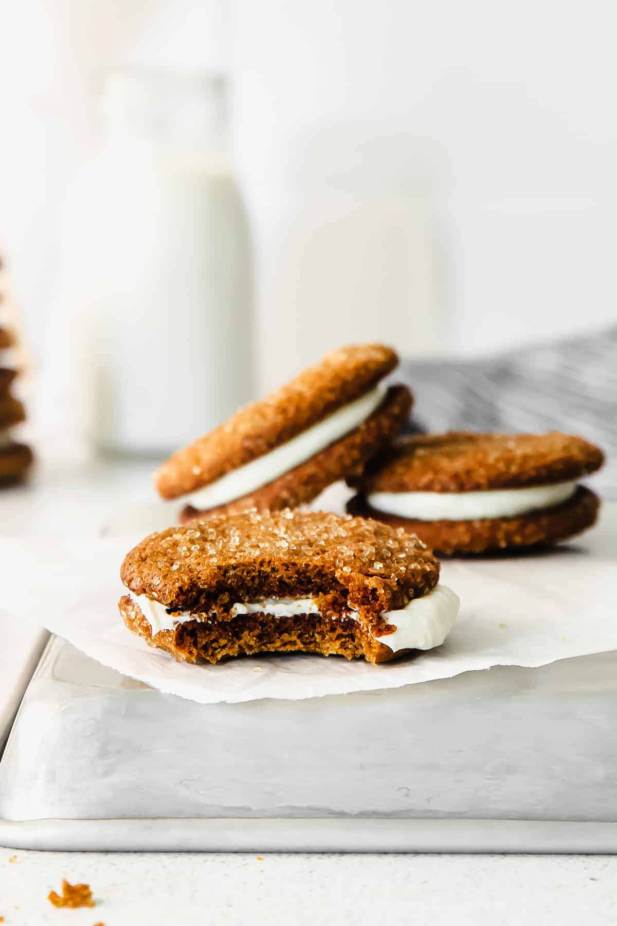 A whoopie pie with a bite taken out of it. 