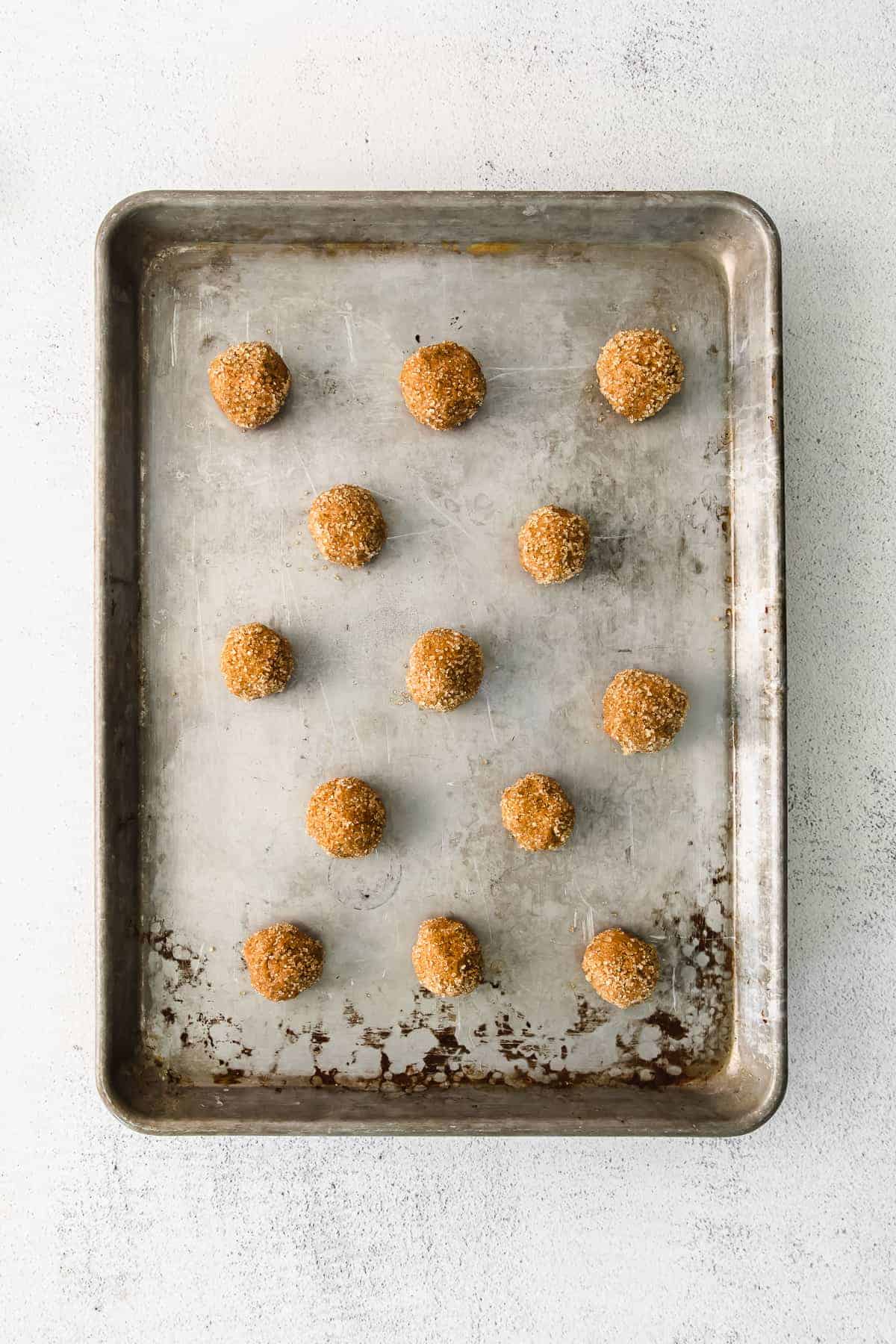 Ginger Whoopie Pies rolled on a baking sheet. 