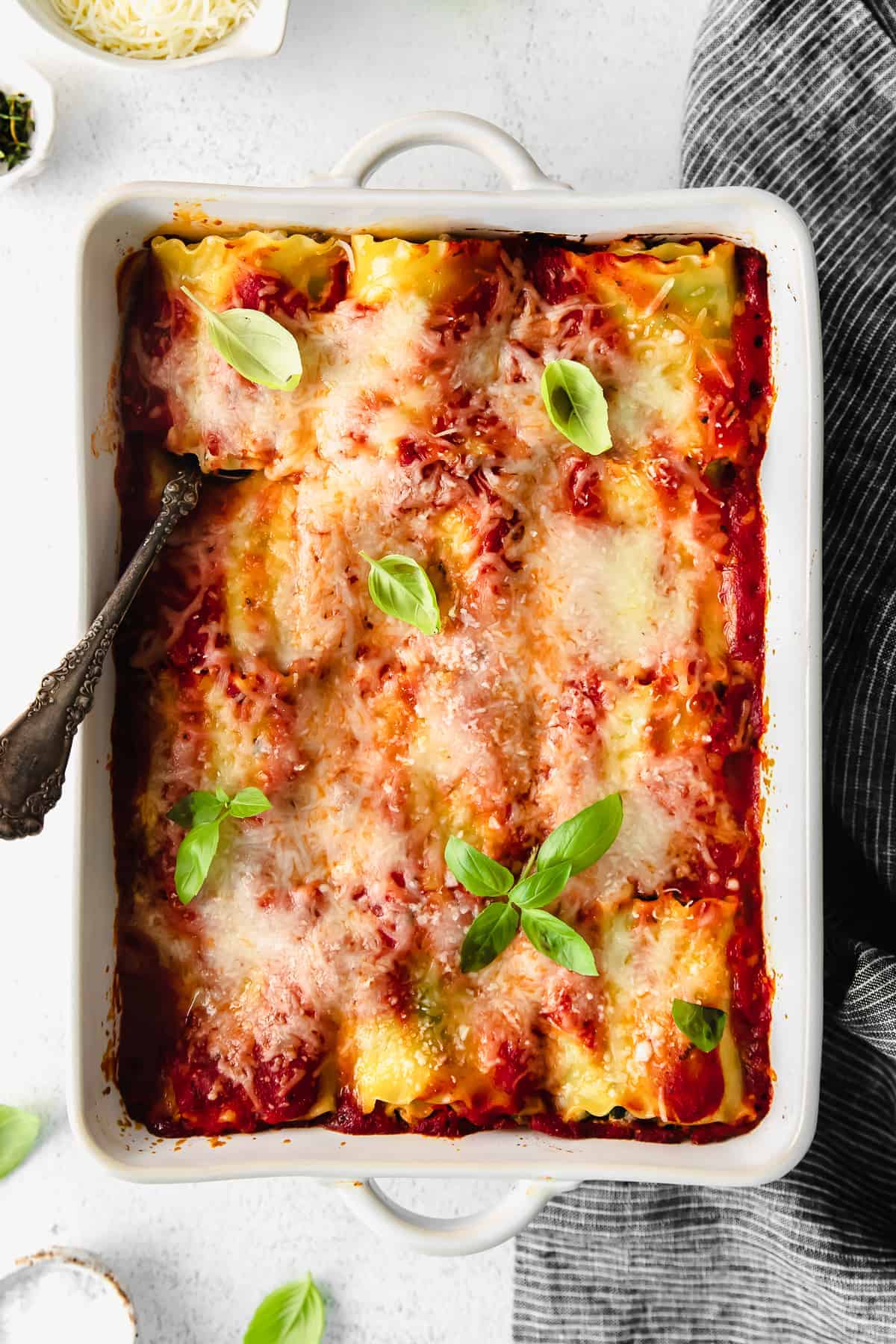 Lasagna roll ups in a baking dish. 