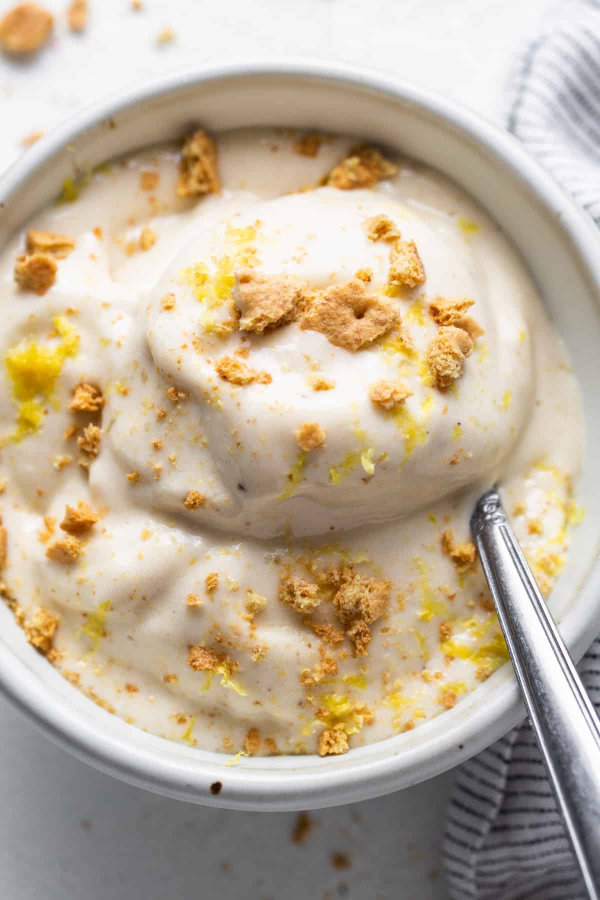 A bowl of ice cream with a spoon.