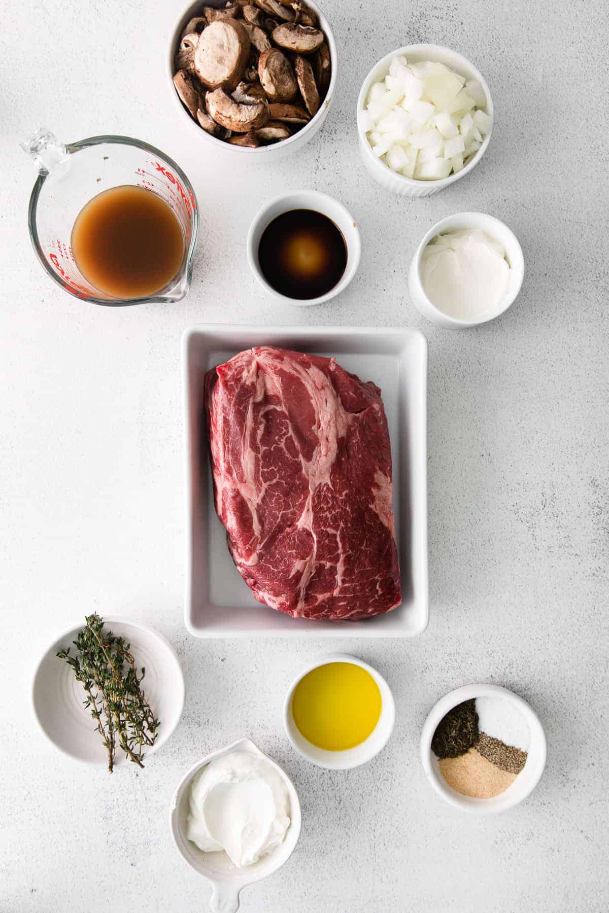 ingredients for slow cooker beef stroganoff in bowls