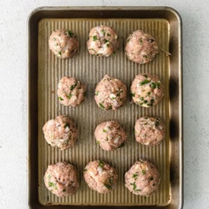 Meatballs on a baking sheet.