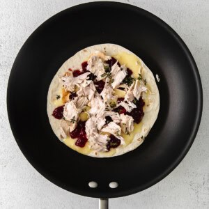 A Thanksgiving leftover quesadilla with turkey and cranberries.