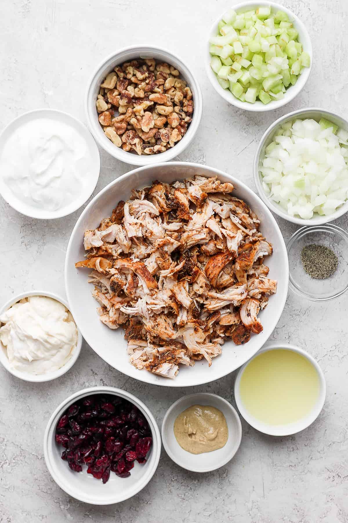 Ingredients for turkey salad in a big bowl. 