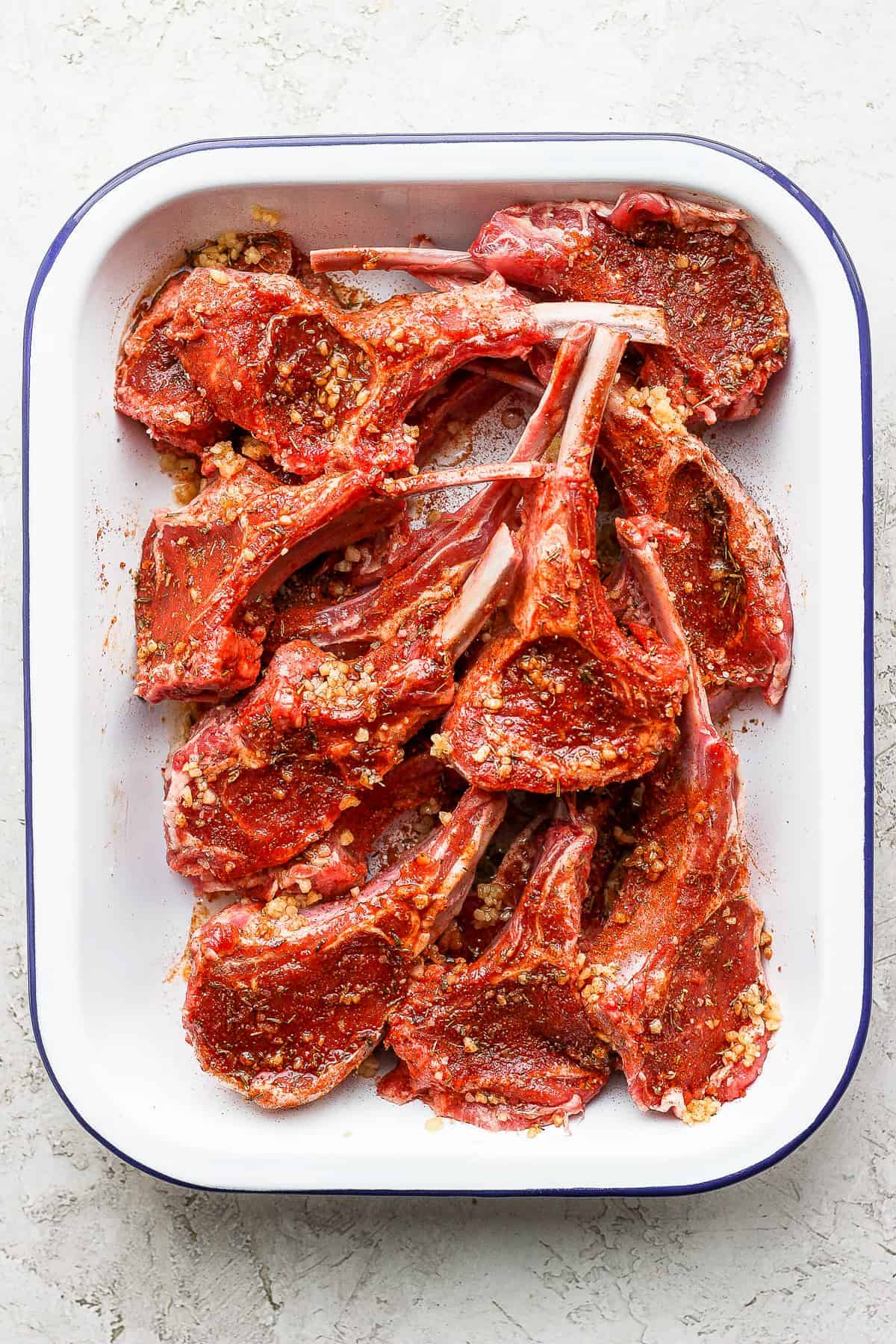 raw lamb chops seasoned with a dry rub