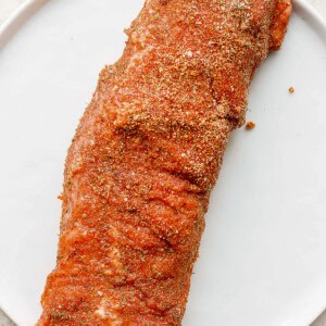 An air-fried pork tenderloin served on a white plate.