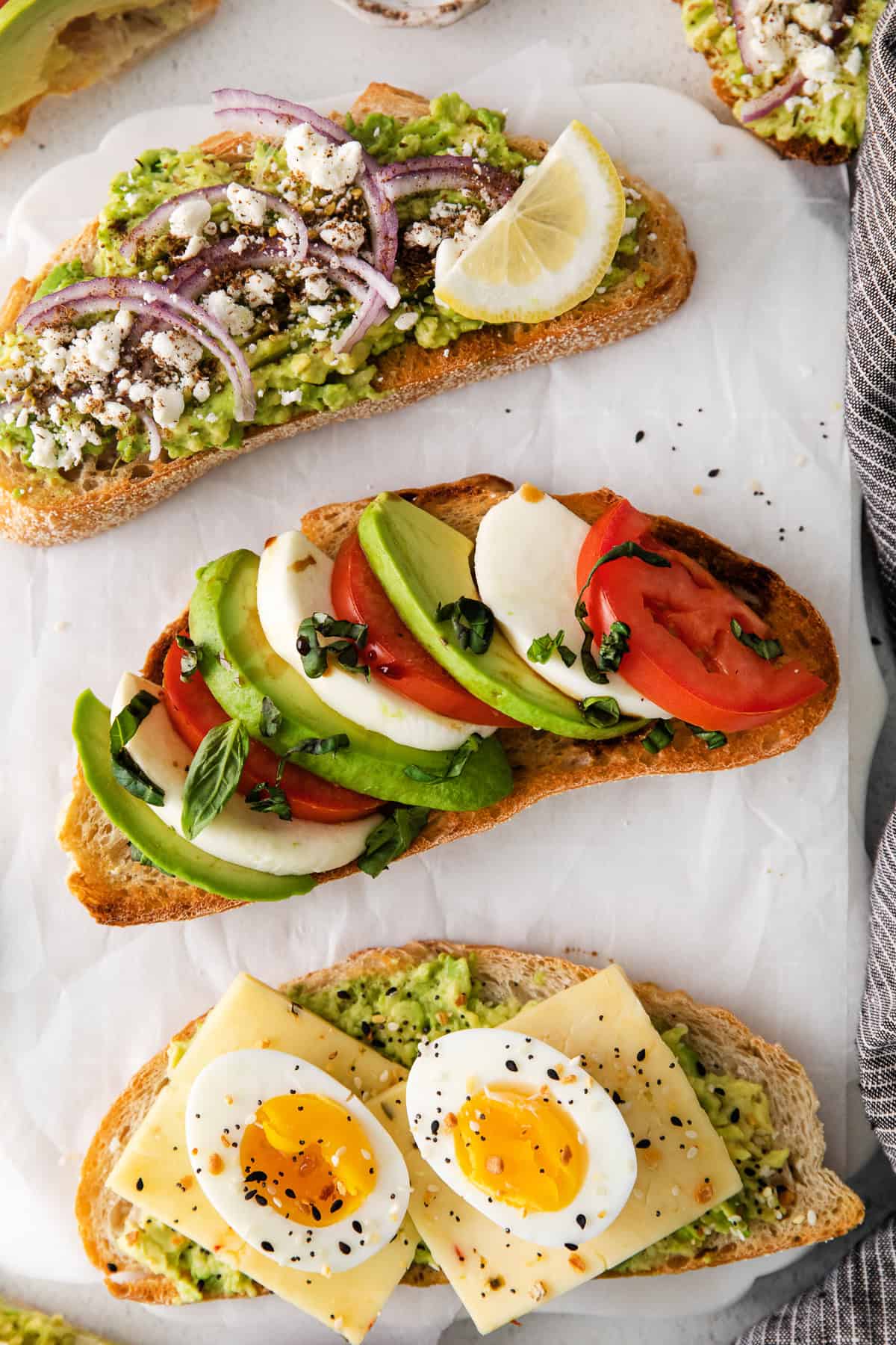 avocado toast topped with caprese ingredients