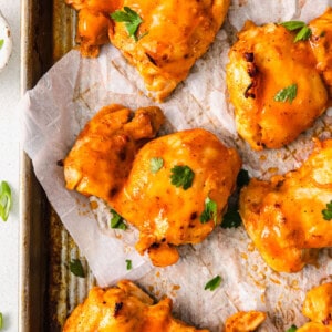 Buffalo chicken wings baked on a baking sheet