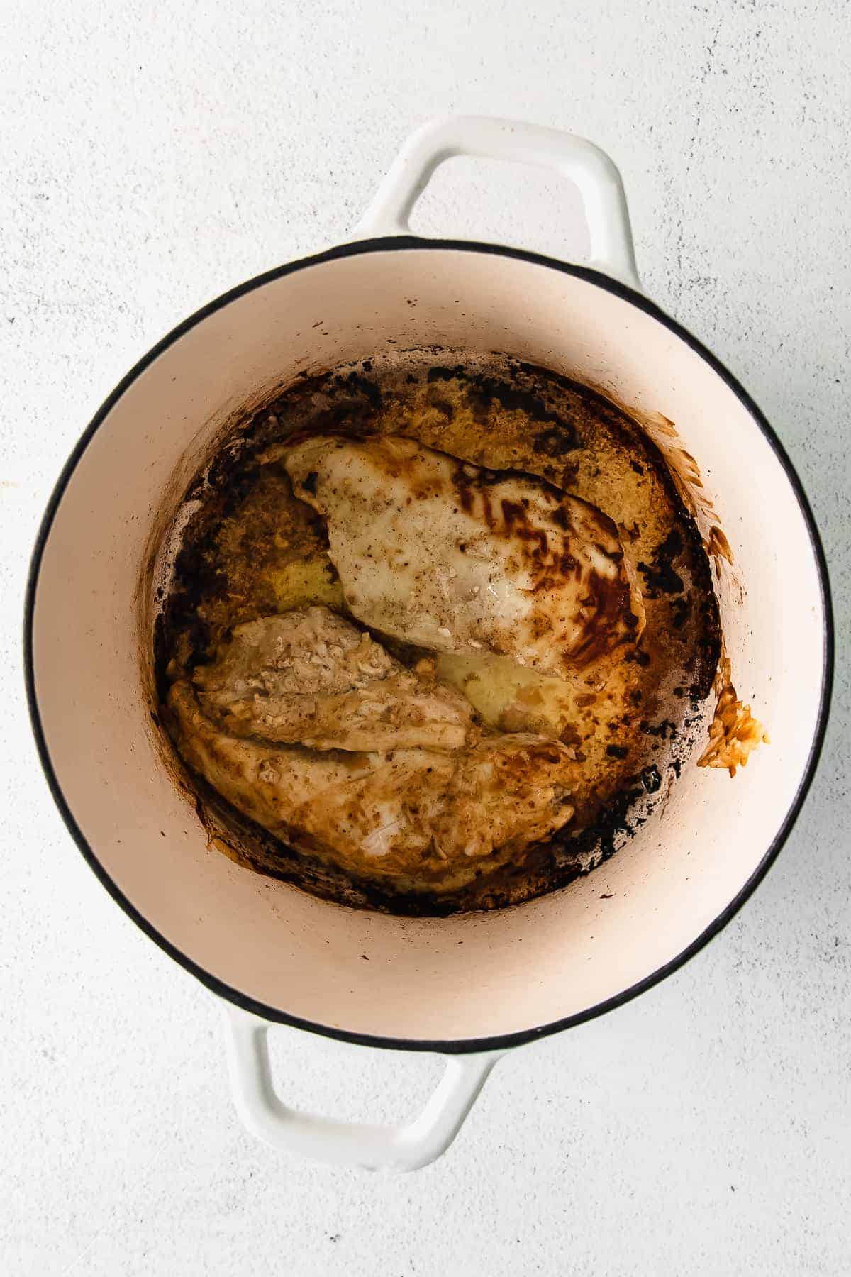 Chicken thighs in a dutch oven. 