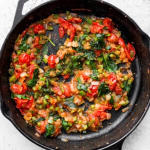 Sautéd vegetables in a skillet pan.